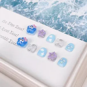 Handmade 10pcs children's press-on nails set with blue sea theme and cute 3D charms