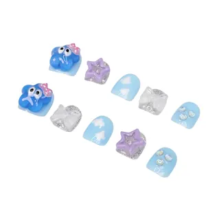 Handmade press-on nails for kids with cute cartoon stars and white bow designs