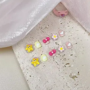 Handmade 3D cartoon press-on nails for girls featuring star and bow resin designs