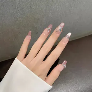 Pink French ombre press-on nails with glitter butterfly and rhinestone accents