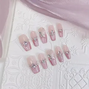 Pink gradient coffin press-on nails with silver butterfly and heart rhinestone charms