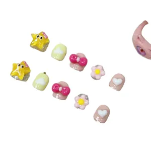 Handmade 10-piece cute cartoon nail art set for girls featuring resin stars and flowers