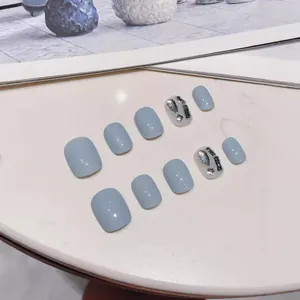 Handmade dusty blue press-on nails set with elegant silver rhinestones and glitter finish