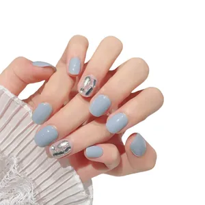 Handmade short light blue press-on nails with shiny rhinestones and gem decorations