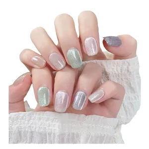 Handmade cat eye press-on nails in pastel colors featuring a high-gloss sparkly finish
