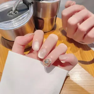 Handmade champagne gold cat eye press-on nails with sparkling rhinestones for autumn