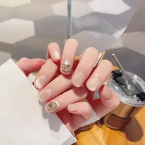 Handmade champagne cat eye press-on nails with luxury rhinestones in short square oval shape