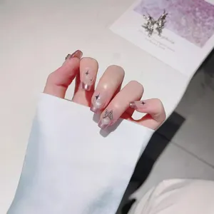 Handmade silver butterfly press-on nails with purple cat-eye gradient and star patterns