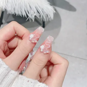 Handmade pink coffin press-on nails with 3D white roses and iridescent snake charms