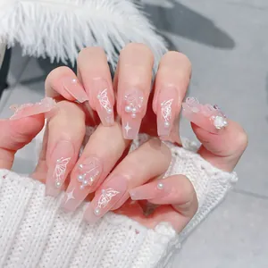 Pink coffin press-on nails with 3D flowers, butterfly art, and pearl decorations