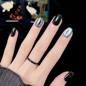 Short black handmade press-on nails with blue cat eye effect and cool trendy design