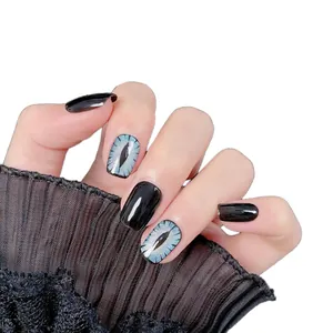 Blue cat eye handmade press-on nails with black glossy finish on model hands