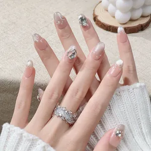 Handmade French cat-eye press-on nails with silver rhinestones and snowflake ring