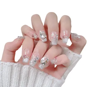 Handmade press-on nails with cat eye gradient, butterfly relief, and heart crystals