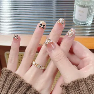 Handmade cat eye press-on nails with pearls and rhinestones in warm autumn style