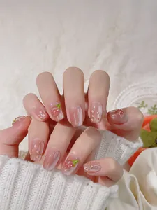 Detail of 3D strawberry cat eye press-on nails with heart patterns on squoval shape