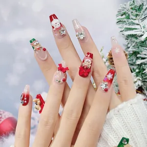 Christmas handmade press-on nails with 3D Santa and gingerbread charms in coffin shape