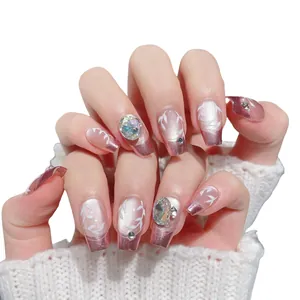 French luxury press-on nails with purple chrome tips, white leaf patterns and rhinestones