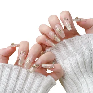 Champagne cat eye coffin press-on nails with golden butterfly and rhinestone details