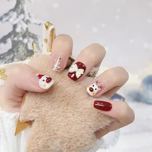 Christmas press-on nails set featuring Santa Claus, reindeer, and 3D bow designs