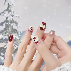Handmade 3D Christmas press-on nails featuring reindeer, teddy bear and snowflake designs