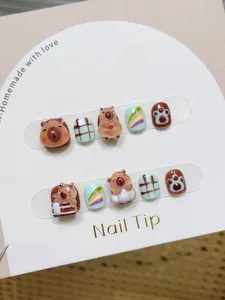 Macro detail of handmade 3D capybara relief design on children press-on nails set