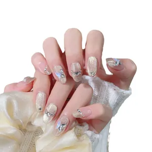 Faux ongles œil de chat champagne avec papillons 3D et strass en zircon brillants