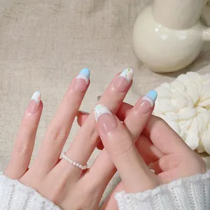 Handmade oval press-on nails with blue French tips and 3D floral texture design