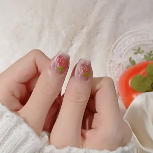3D strawberry cat eye press-on nails with pink glitter finish on white plush background