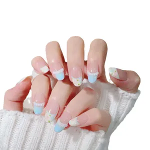 Handmade light blue floral press-on nails with 3D white ruffle tips and oval shape