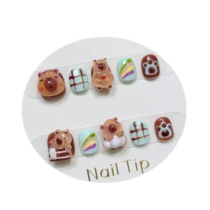 Handmade 3D cartoon capybara press-on nails for kids with cute brown and blue patterns