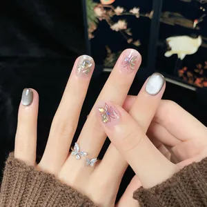 Short handmade cat eye press-on nails with 3D butterflies and sparkling rhinestones