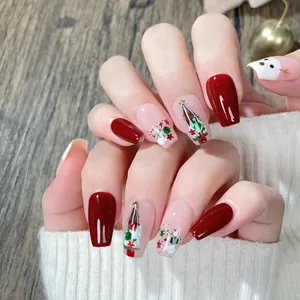 Uñas postizas de Navidad hechas a mano con purpurina roja y diseños de árboles