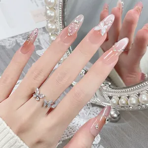 Handmade gradient blush press-on nails with 3D butterfly accents and silver glitter lines