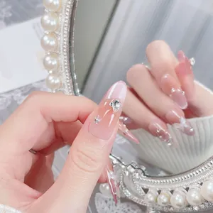 Handmade gradient blush press-on nails with 3D butterfly and rhinestone accents
