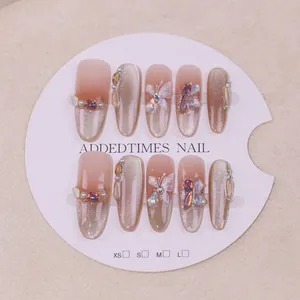 Handmade gold butterfly cat-eye press-on nails with luxury gems and pearls