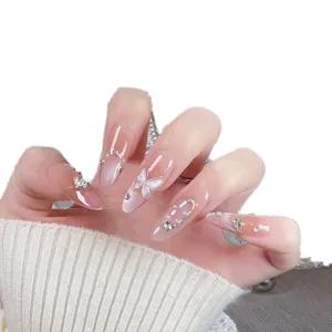 Handmade press-on nails with gradient blush effect, 3D butterflies and pearl accents