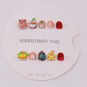 Handmade 3D Christmas press-on nails for kids with reindeer and snowman designs