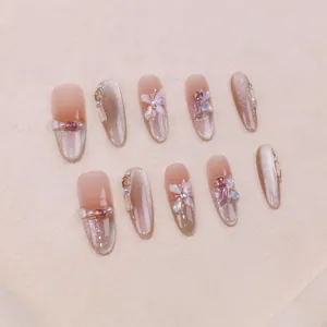 Luxury handmade press-on nails with cat-eye glitter butterfly and pearl accents
