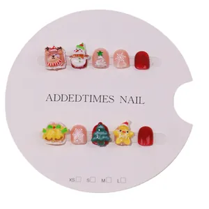 Handmade Christmas press-on nails for kids with 3D reindeer and snowman designs