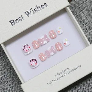 Handmade 3D cartoon pink bow and donut press-on nails set for kids in a gift box