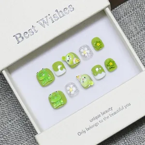 Handmade 3D green frog cartoon press-on nails set with floral accents in a gift box