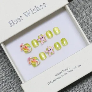 Handmade ocean-themed press-on nails for kids with 3D seahorse and starfish charms
