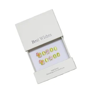 Sparkly yellow ocean theme press-on nails with 3D seahorse and starfish in a gift box