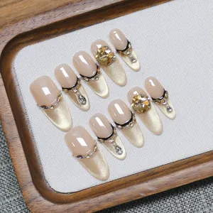 Handmade champagne cat-eye press-on nails with luxury almond shape and crystals
