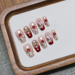 Handmade gradient red press-on nails with luxury rhinestones and gold glitter accents