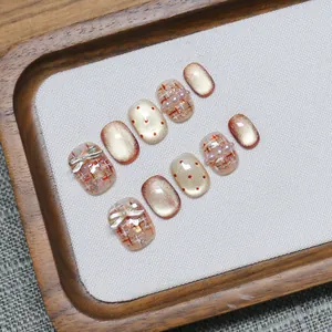 Pink cat eye handmade press-on nails set with tweed pattern and pearl bow accents