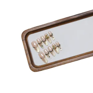Long pointed handmade champagne cat eye press-on nails with rhinestones and French lines