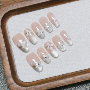 Handmade cat eye press-on nails with 3D floral accents and silver magnetic gradient finish