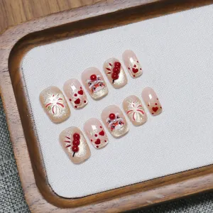Handmade press-on nails with Lunar New Year lion dance and glitter cat-eye festive design
